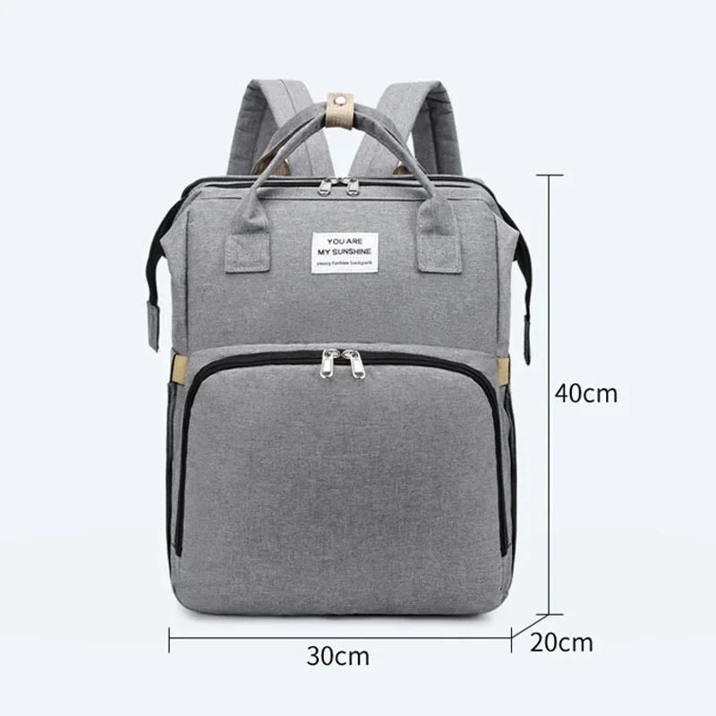 Foldable nappy bag backpack shown with 40 x 30 x 20cm dimensions