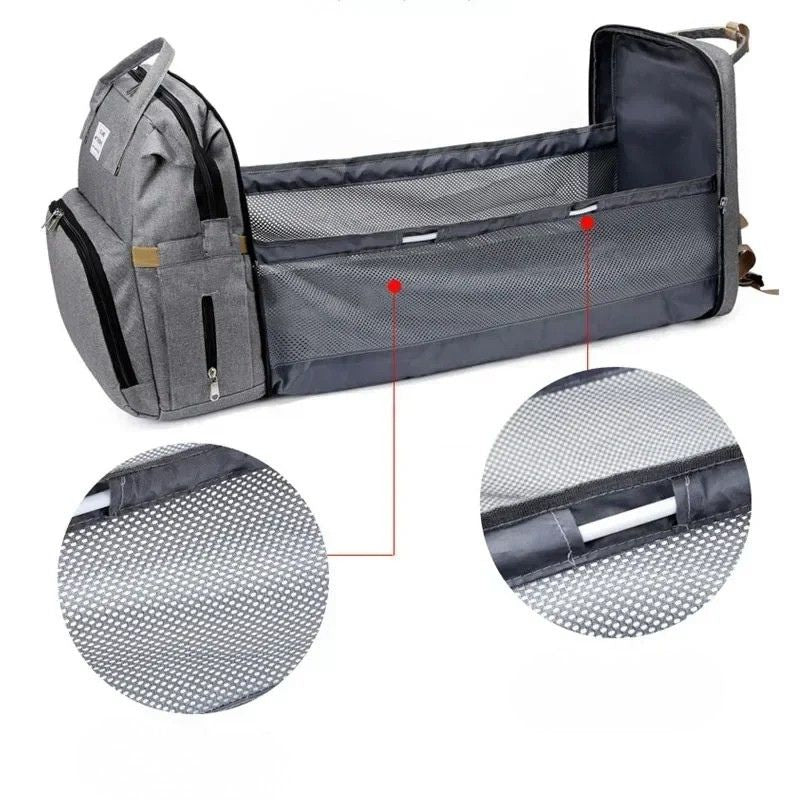 Nappy bag backpack folded flat into a padded surface for supervised use