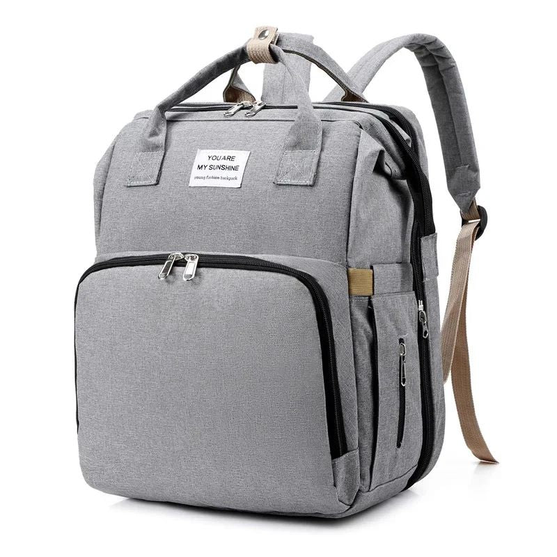 Lior nappy bag backpack in grey standing upright