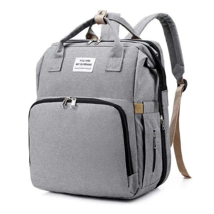 Lior nappy bag backpack in grey standing upright