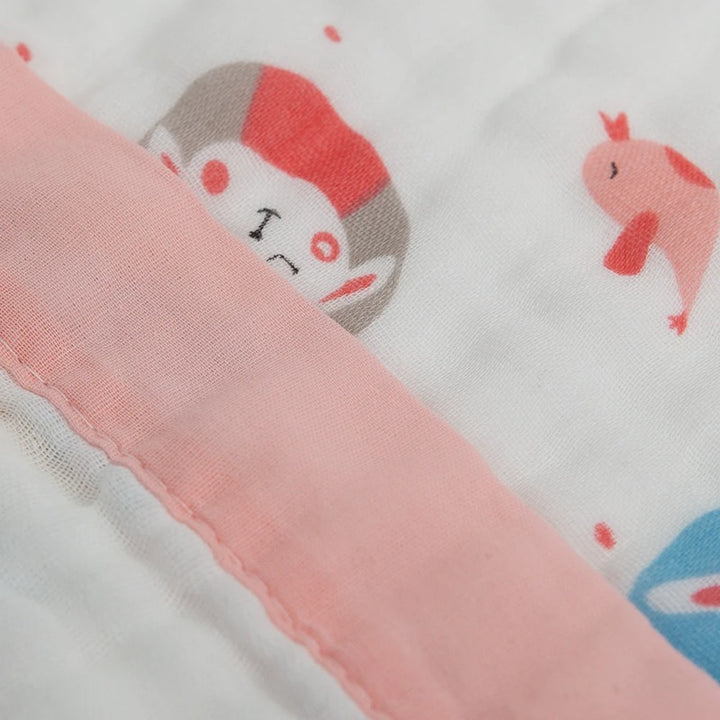 Close view of pink bound border stitched to printed gauze