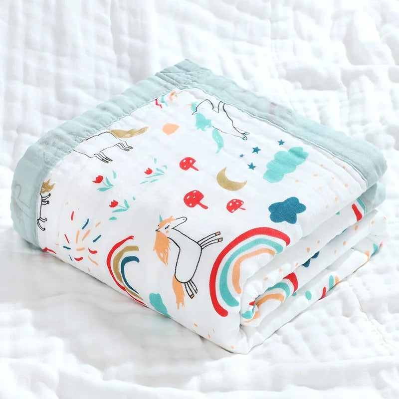 Unicorn and rainbow print wrap folded with green border